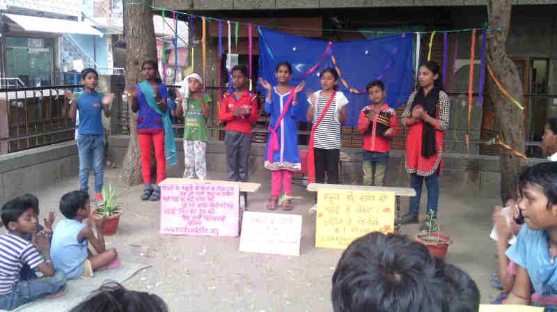 People watching street play – चमेली की पढ़ाई – which highlights the problems in the current education ecosystem.