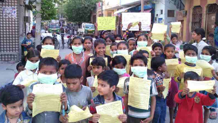 Children demonstrating in the streets of New Delhi so that the Indian / Delhi Government should protect them from dust pollution, noise pollution, and air pollution coming from extended FAR construction activity in Delhi's housing societies. Photo and Campaign by Rakesh Raman